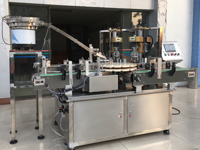 capping machine with 2 capping heads oprema za zatvaranje vijaka poluautomatska.jpg