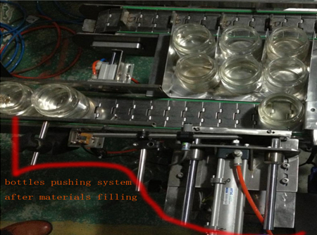 automatic bottles pushing system after filing bottle pushing system.jpg